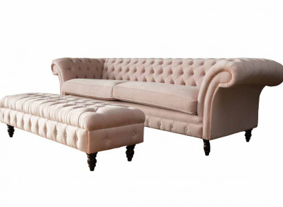 A luxurious pink four-seater sofa in Chesterfield design, including seat cushions