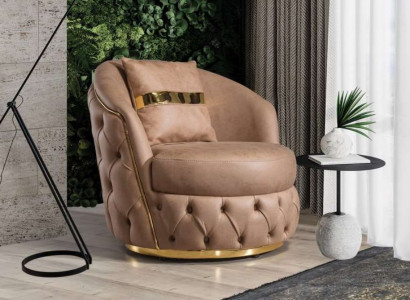 A luxurious, modern armchair in a light beige tone from Chesterfield